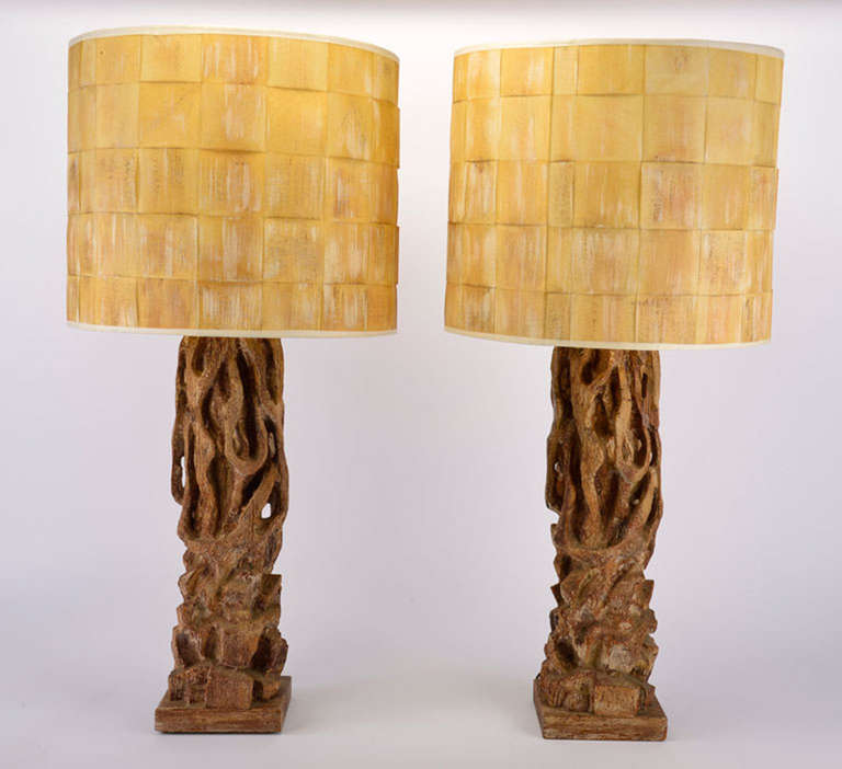 Pair of tree trunk table lamps in gilt, and polychrome wood, with original parchment painted shades, in outstanding original condition.

Dimensions: 44.5