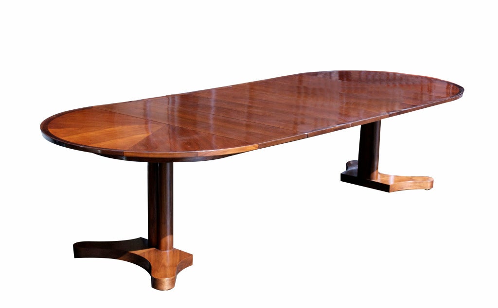 An innovative Wormley design for Dunbar. This beautiful round rosewood and walnut dining table is ideal for an apartment size dining room or living-room as it stands closed at four feet round and is gorgeous as a center-table or foyer table. It