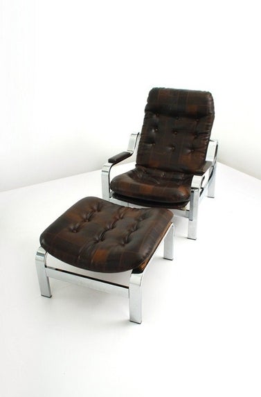 An adjustable patchwork leather lounge chair by Knoll. USA, circa 1970. A rare possible prototype or custom reclining lounge chair and ottoman by Knoll Associates. Chrome-plated steel frame with patinated and button tufted patchwork chocolate