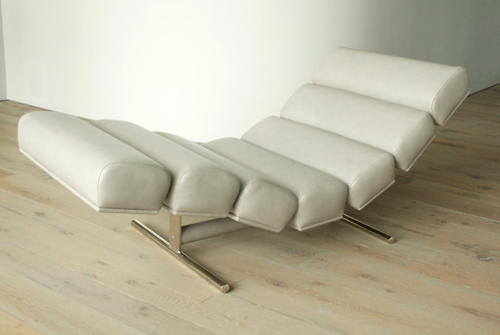 A segmented lounge chair by Gervan, Belgium, circa 1970s. A stunning segmented lounge chair in leather. This modern lounge has a solid chrome-plated steel base with leather wrapped cross bar. The deep recline of the lounger lets this double as a