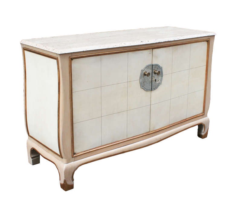 A generously proportioned French server with inset parchement panels, antique mirror eschtuchen and lock, creme painted exterior with gilded trim, the original top in natural French limestone, case in pine. 

The interior fitted with three flat