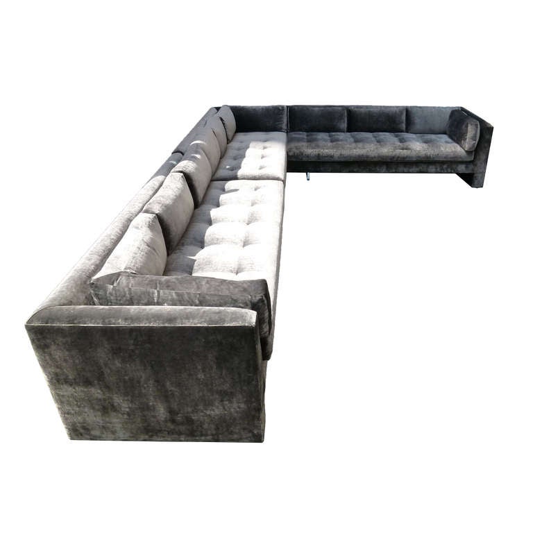 This extra-large sofa is composed of three sections. All sections newly upholstered in Romo Orbit Tungsten Silk Velvet replicating all original Kagan details. A Lucite support on each section gives the sofas a cantilevered appearance, in the classic