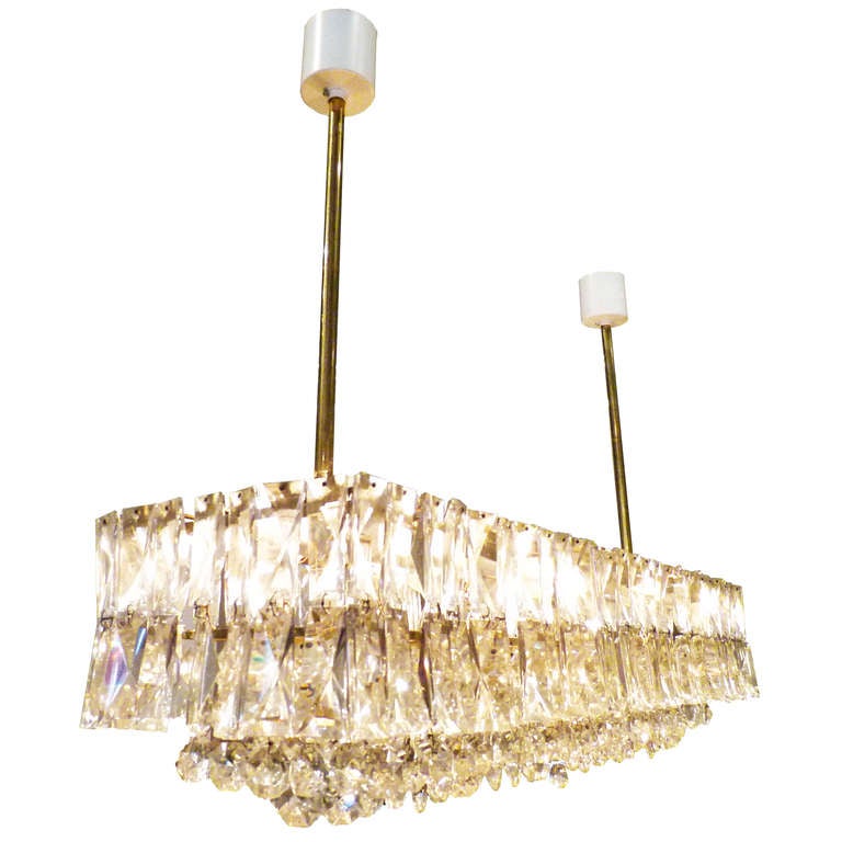 An excellent example of Lobmeyr’s finest work in brass and crystal lighting. This chandelier exhibits the firm’s sense of ostentatious style and superior craftsmanship. Like our other chandeliers by Lobmeyr, it evokes fine jewelry in both its design