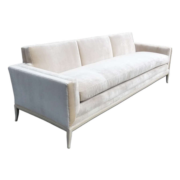 An early three- seat sofa by Tommi Parzinger dating from the mid to late 1940s with bleached mahogany base. The sofa reupholstered in Nancy Corzine Pearl 100% silk velvet.

The whole sofa double boxed without welting with three attached back