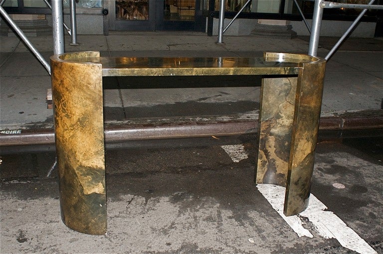 Rich brown goatskin conosle table in satin matte lacquer by Karl Springer featuring curved ends. The goat skin with a beautiful grain giving a tortoise like pattern and coloration to the table.
Very good original condition. Dated 1977.