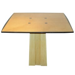 A Modern Parcel-Ebonized Tiger Maple Center Table, by Dakota Jackson