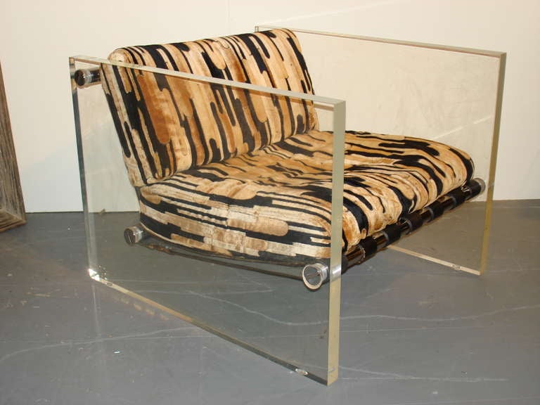 the cube shaped chair with thick Lucite slab panels supporting chrome bar leather straps and cushions. Upholstered in original black and gold velour