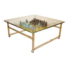 A Modern Chrome and Glass Games Table with Bronze Chess Set
