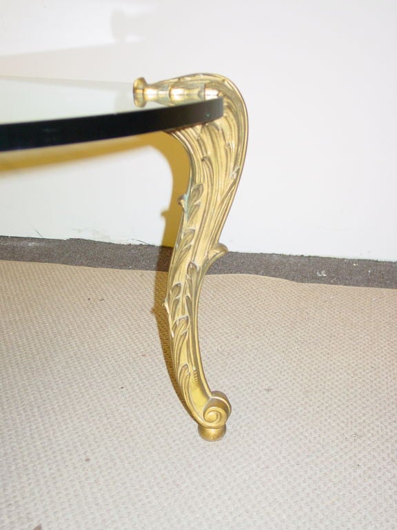 the lobed rectangular top on four finely leaf-tip cast cabriole legs with scrolling feet. Each stamped P. E. GUERIN inc NEW YORK