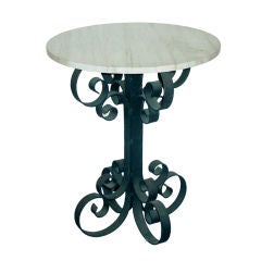 A Modern Wrought Iron and Travertine Gueridon A Modern Wrought Iron and Travertine Gueridon