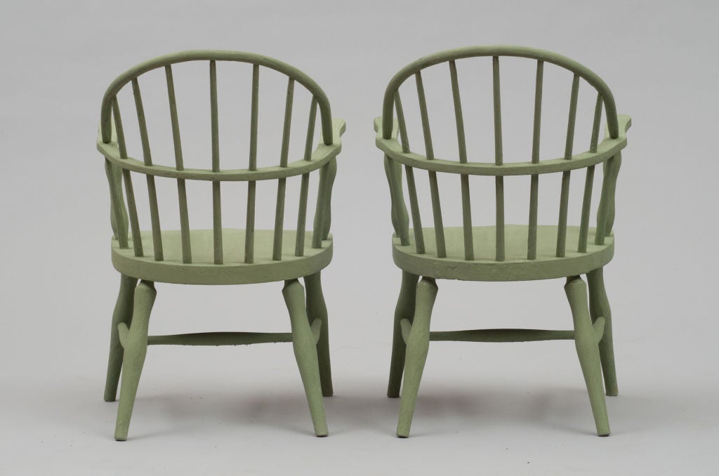 A matched pair of child sized windsors with turned legs and arms, and a fan back. Classic design with charming proportions. Refinished in a dark lime milk paint.