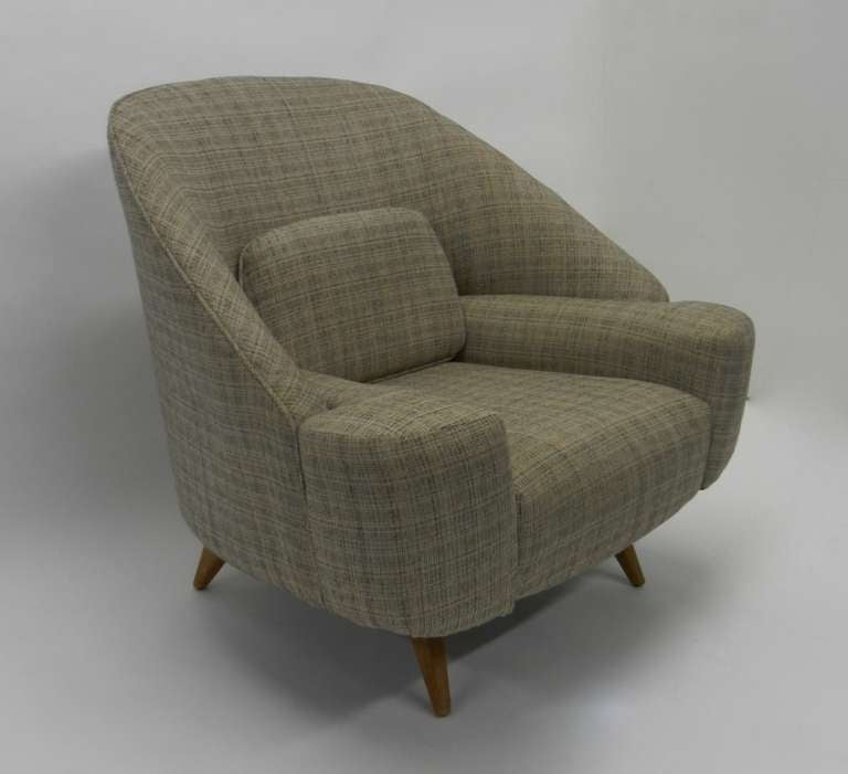 1950s beautifully designed armchair. The chair is in it's original fabric which is super clean and in excellent condition. It almost looks and seems like the whom chair was copied from it.