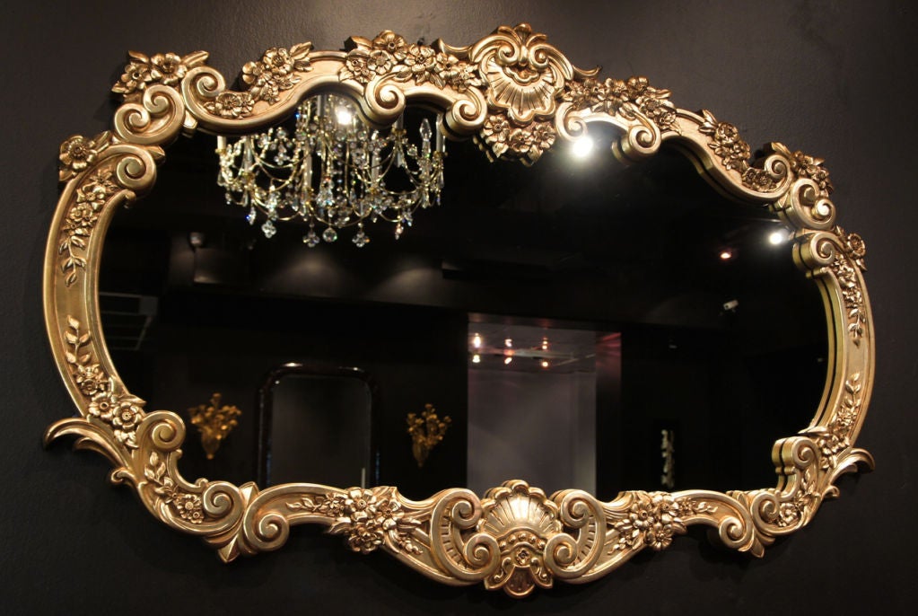 Dazzling Neo-Baroque framed mirror.  Gloriously detailed frame is cast-resin, painted and gilded in gold.  Extremely well-finished with no seams or any other casting defects.  Recently Dart Industries' inventory of casting molds was destroyed, which