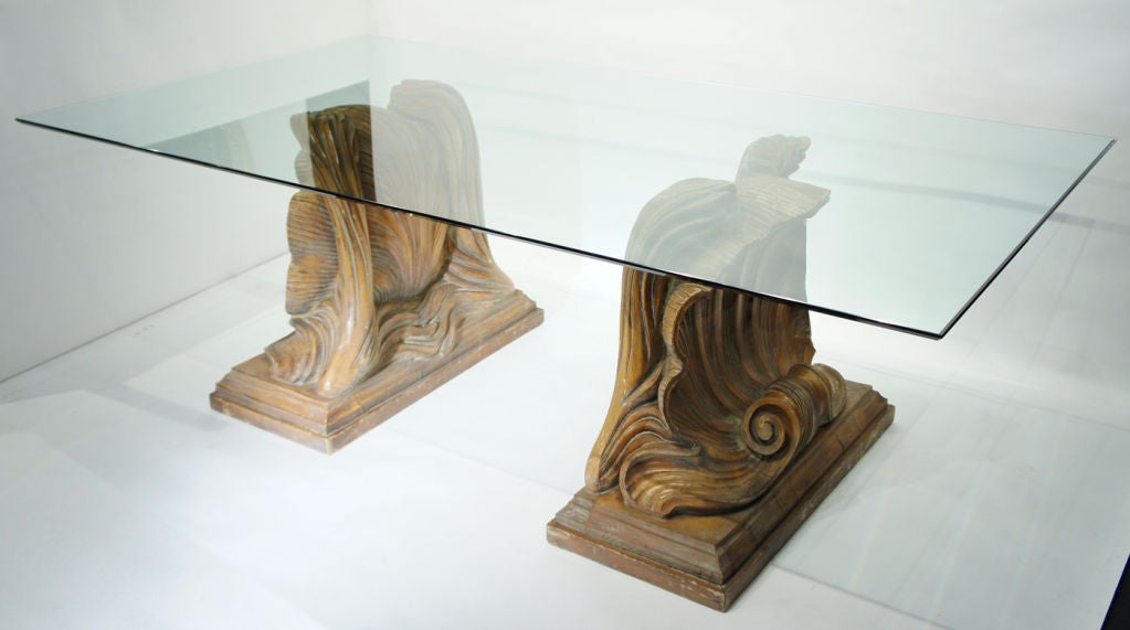 Spectacular pair of shell-motif table bases, hand-carved in wood.  With half-inch glass top, 47 x 86.