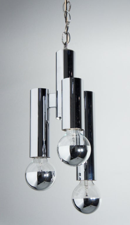 Three different-length fixtures triangulate outward from a center cylinder to making for a compact and clean ceiling light.  Highest quality construction, mirror-polished chromed steel.  Newly rewired, first class working condition.

[sold as