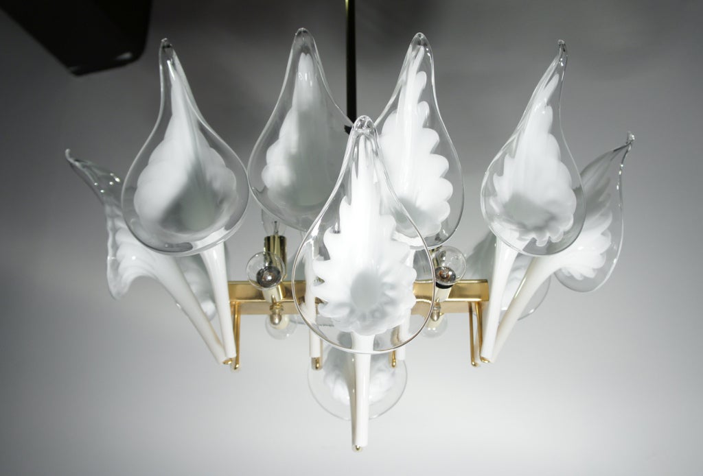 The calla lilies are in bloom again. But this time, they are from the glass blowers of Murano. 12 voluptuous blossoms are arranged on a brass fixture resulting in this fusion of modernist utilitarianism and Art Nouveau-inspired indulgence. Newly