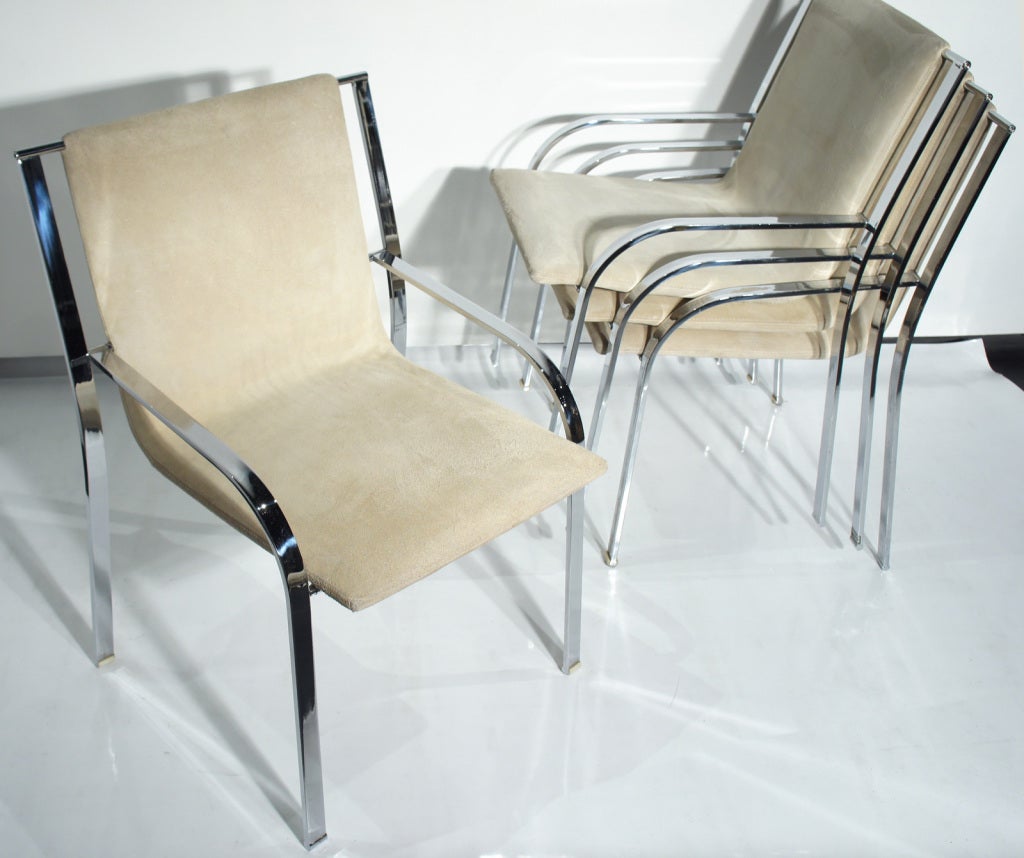Set of four stacking chairs in curving chromed steel and celadon suede. Minimalist design and adaptable: handy for last minute guests. Saporiti label under seat.  $795 is for all four!