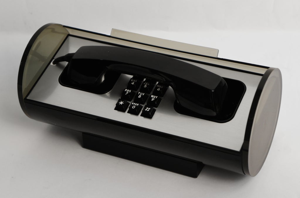 For the executive who has everything…a swank desk phone with convertible top.  Classic Bell ergonomic receiver attaches to the base using a 42