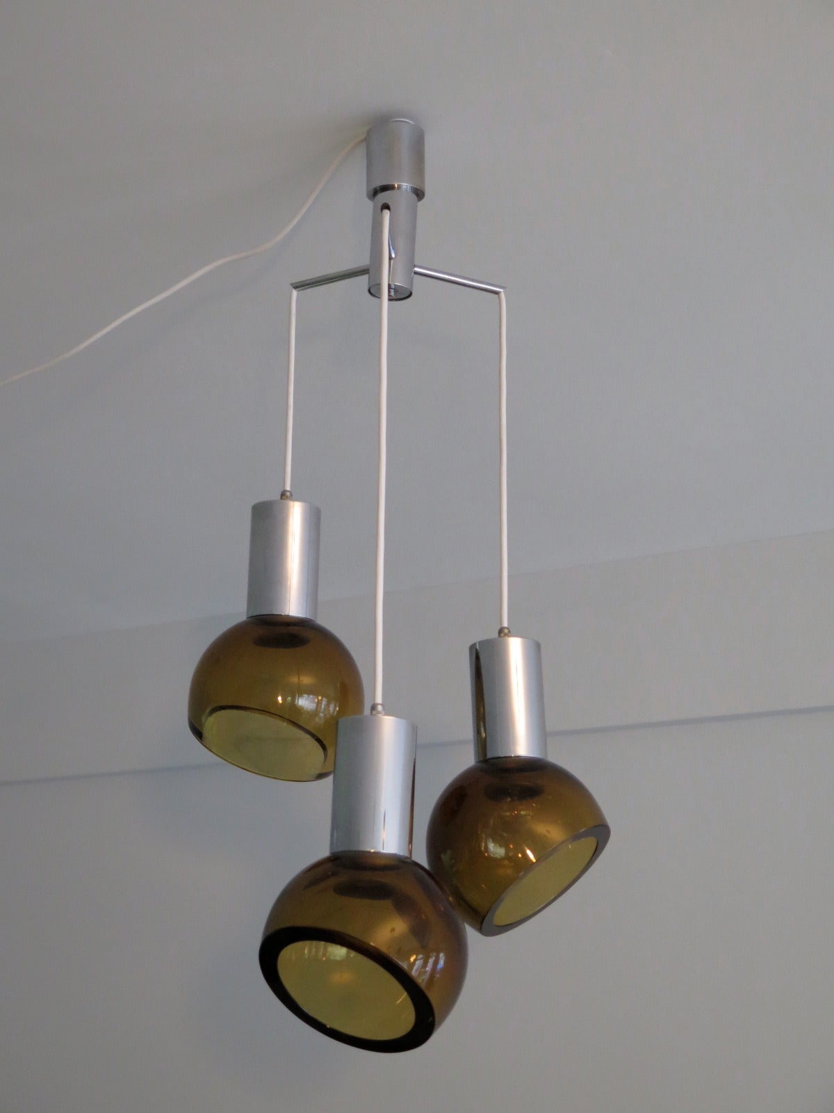 An unusual chandelier with heavy amber glass by Seguso, Italy, circa 1960. Shades can be pointed in different directions.