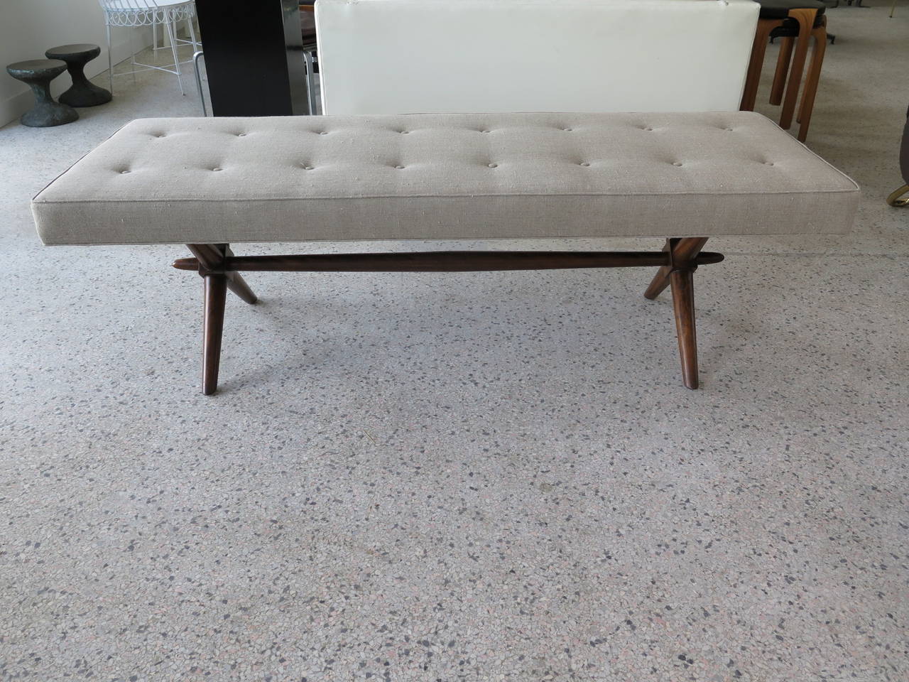 A classic T.H.Robsjohn-Gibbings for Widdicomb upholstered bench. Walnut X base design, in original finish. Seat reupholstered in natural linen.