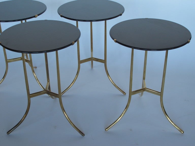 A collection of four Cedric Hartman tables in polished bronze and honed granite tops. Elegant and classic form. Priced $3,750 each.
