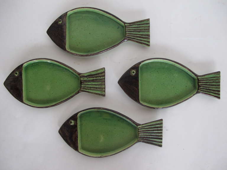 A set of four charming fish platters by Ettienne Noel, France.