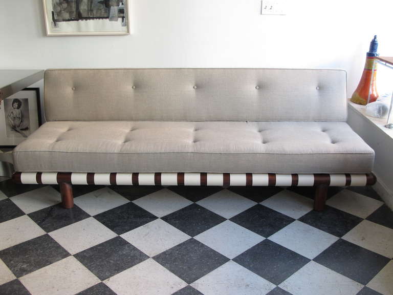 A classic strap sofa by T.H. Robsjohn-Gibiings for Widdicomb. Completely restored, new strapping, new upholstery.
