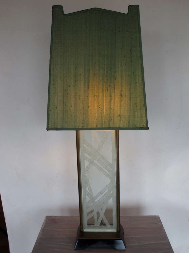 A large, rare lamp by james Mont. Etched glass with stylized bamboo motif, laquered base. Original base and shade (recovered in green silk). Overall height including shade 39