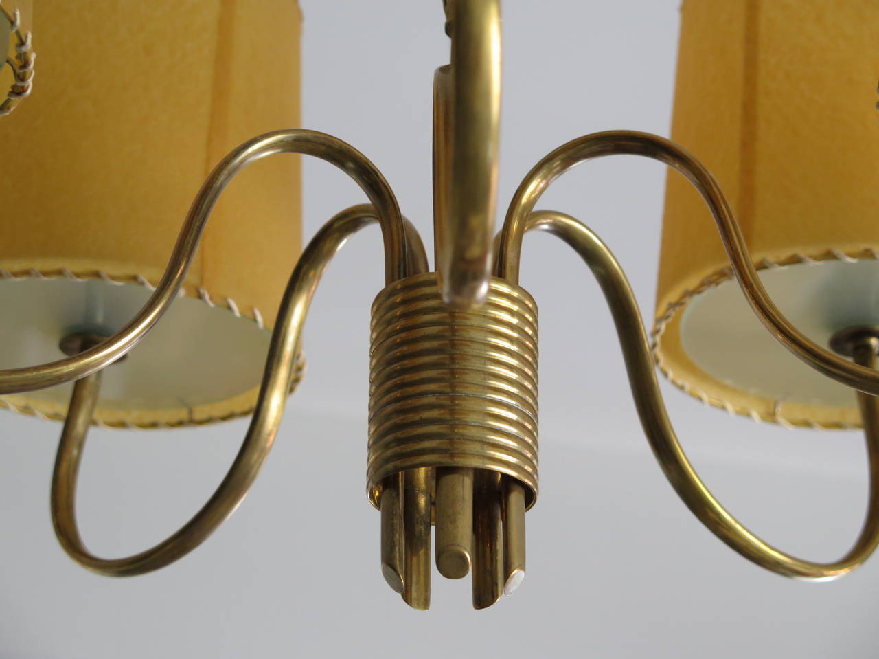 A Paavo Tynell for Taito chandelier. Brass with stylized leaf decoration.