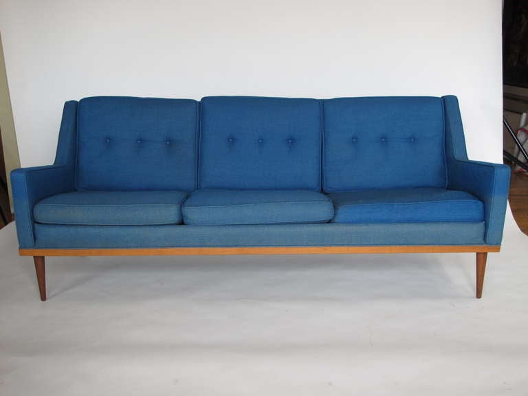 Unusual and space age quirky-very period, 1967 three seat sofa with walnut frame and dowel legs. Great lines-very Jetsons-Mod.
Fully signed with original upholstery.