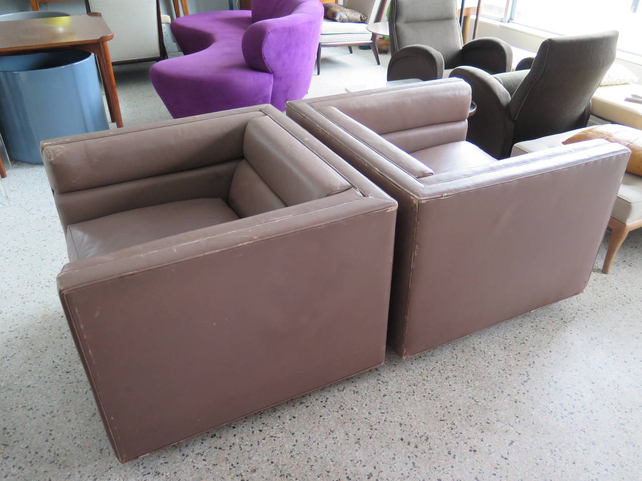 A pair of impressive, large-scale, cube-shaped Dunbar chairs in original leather. Designed by Roger Sprunger, ca'1970's.