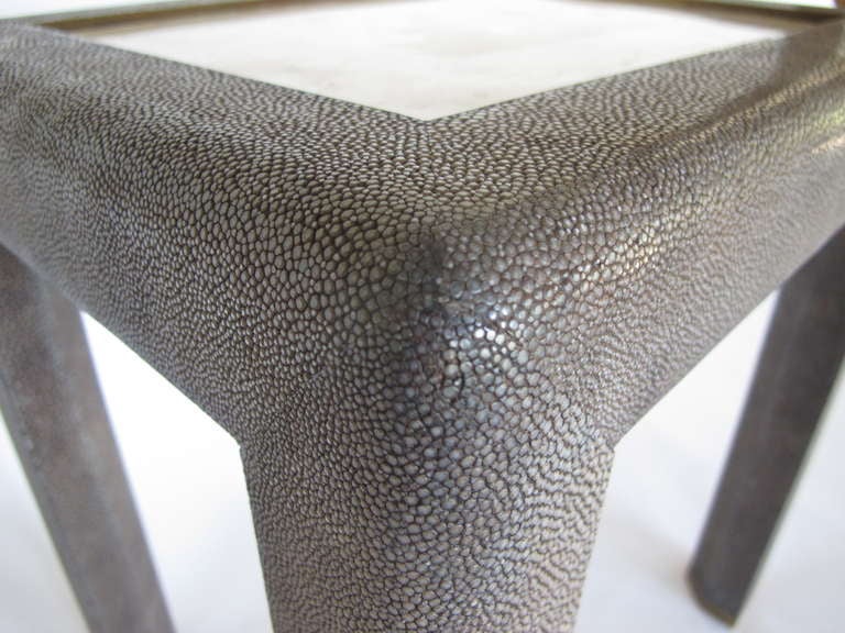 A beautiful and elegant tessellated stone/shagreen table by Maitland-Smith, with brass picture frame detail and brass feet. Great as a side table or occasional table or a drink stand.