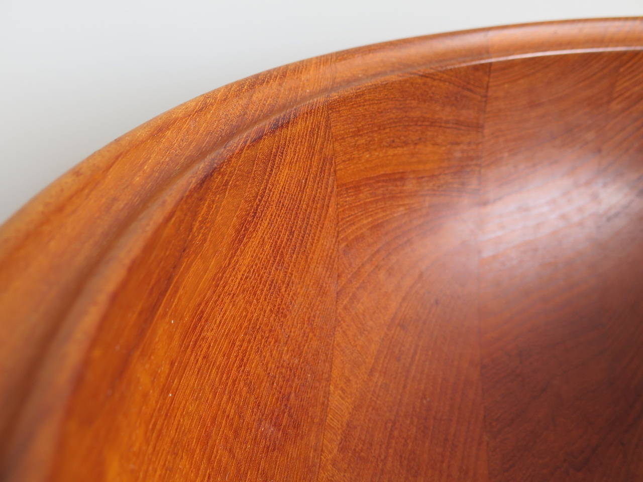 A large bowl in teak by Henning Koppel. Made in Denmark, retailed by George Jensen, includes original box when purchased, circa 1960s