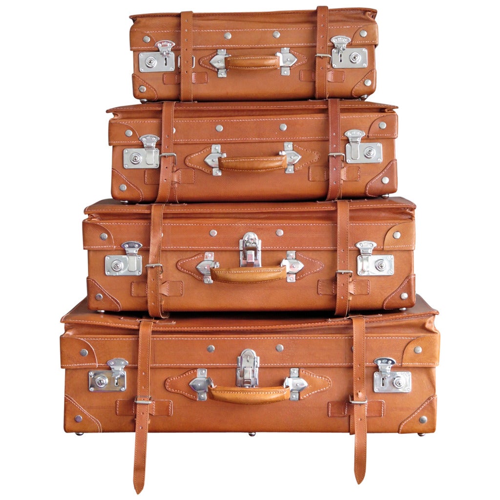 Set of Four Vintage Unused Leather Suitcases