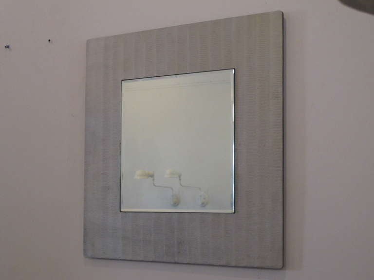 An elegant, etched aluminum mirror by Lorenzo Burchiellaro.