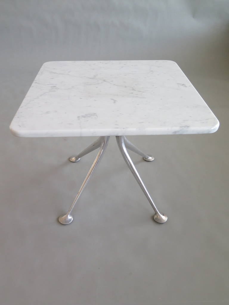 A rare marble top table by Alexander Girard for Herman Miller, circa 1960s.