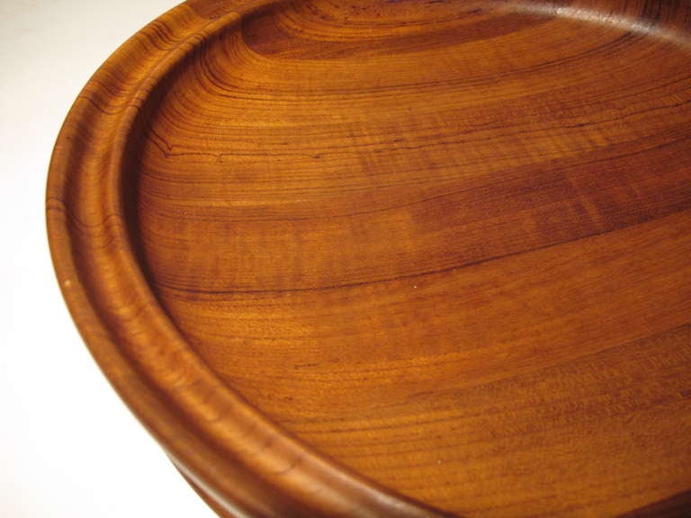 A beautiful Henning Koppel teak bowl with rare tray, for George Jensen. Very good condition with rich patina.