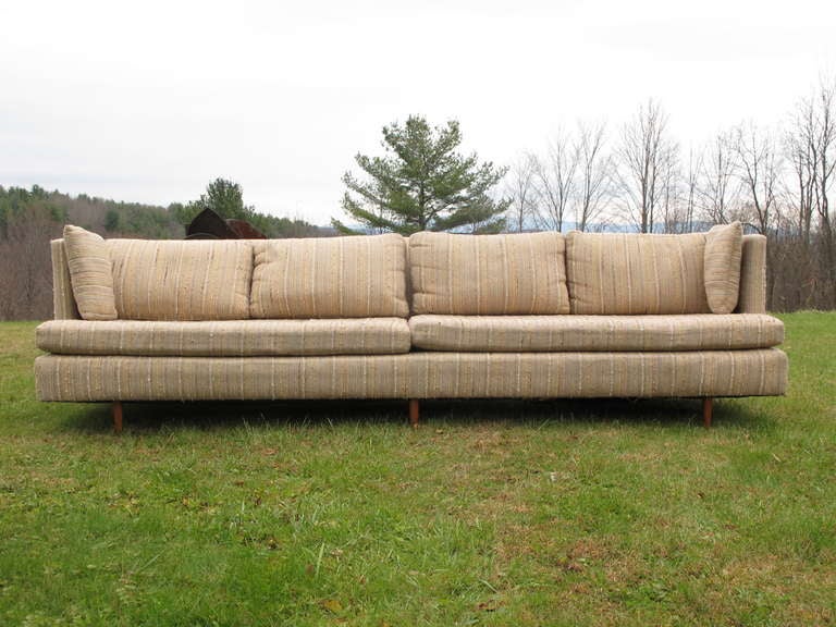 A Classic 9ft. long floating sofa attributed to Edward Wormley for Dunbar,
circa 1950s. Walnut legs.