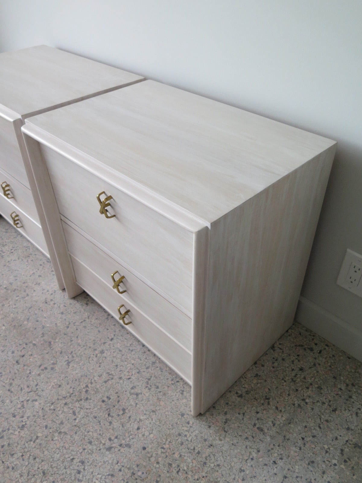 A pair of Paul Frankl for Johnson furniture nightstands with polished X-handles. Custom white washed finish.