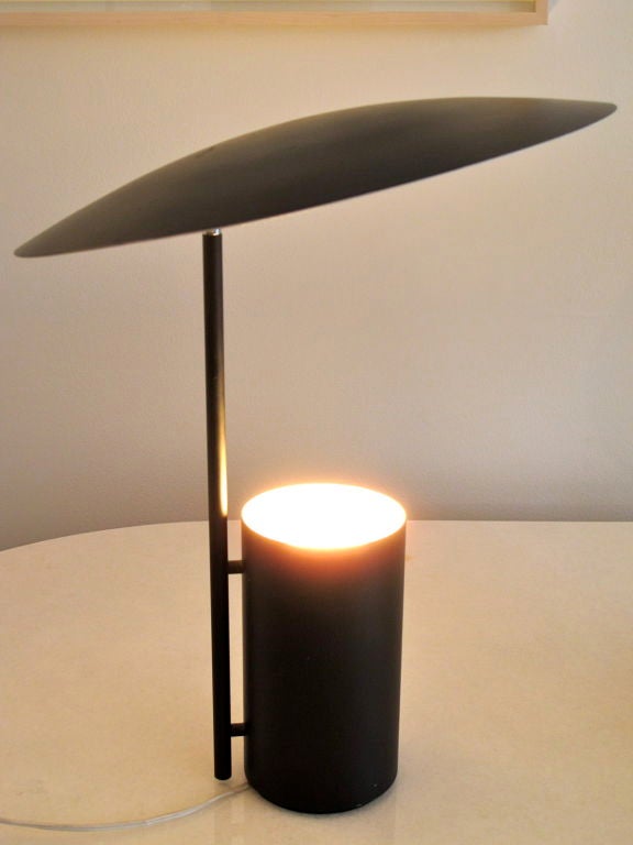 A classic black, adjustable saucer/reflector table lamp by George Nelson for Koch/Lowy.