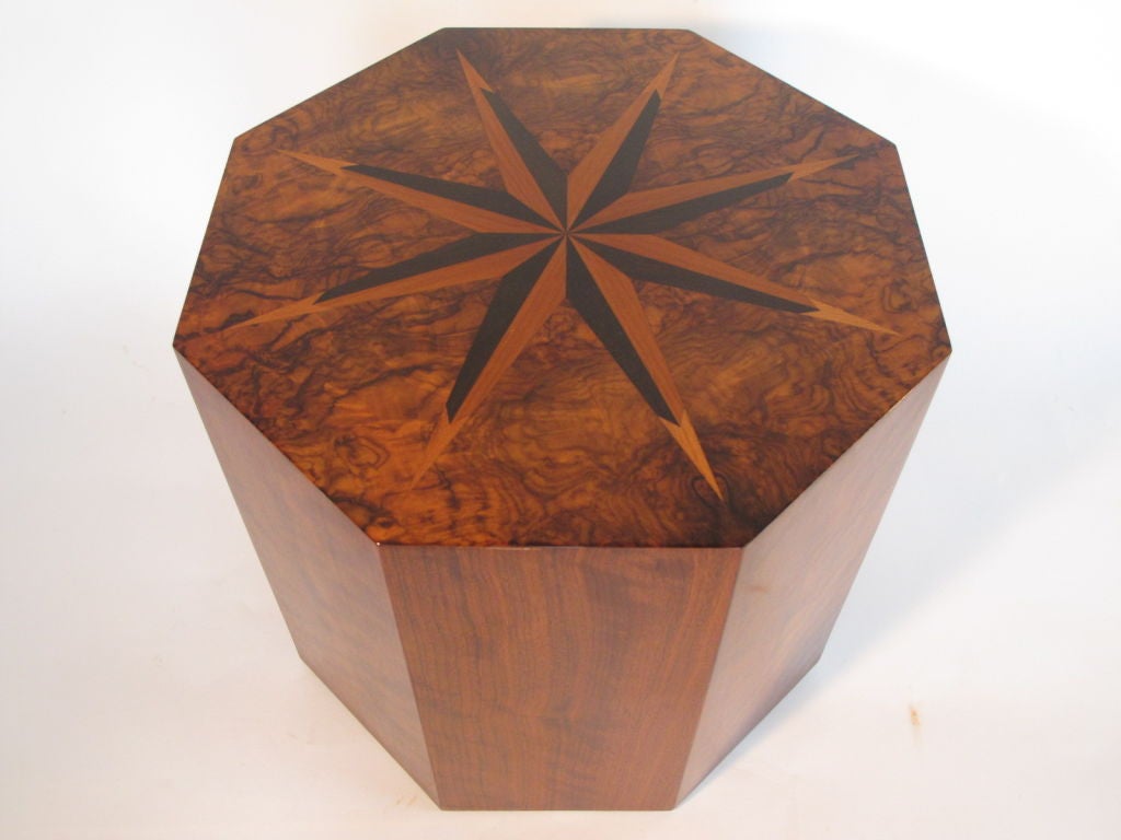 A rare eight sided table by Andrew Szoeke. Made of walnut and exotic wood veneer inlays on top forming a sunburst pattern.