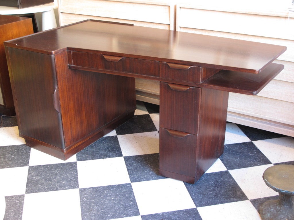 A great Edward Wormley Dunbar desk with extension, bentwood handles and rear storage compartment.