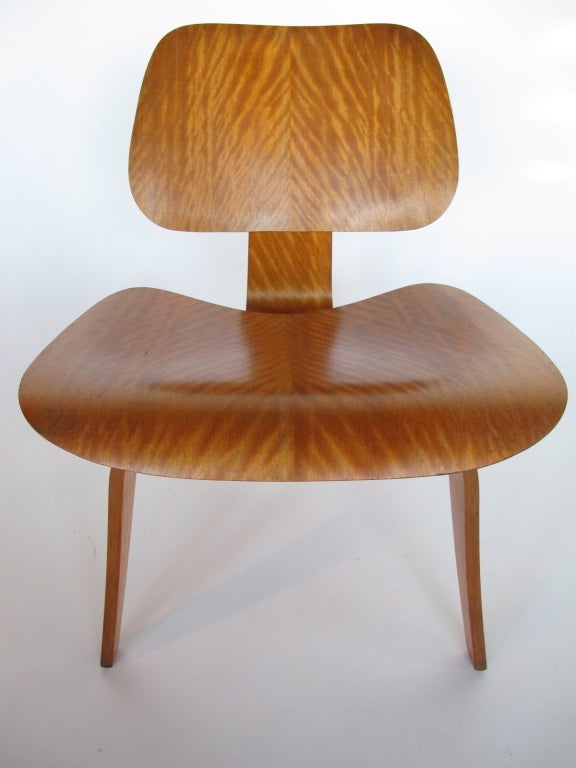 A rare Charles Eames LCW (lounge chair wood), Evans, pre-Herman Miller production in avodire veneer.