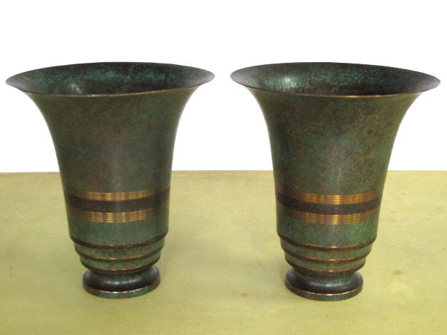 A pair of large Carl Sorensen, bronze vases with a patinated, verdigris finish.
Measuring 10.5