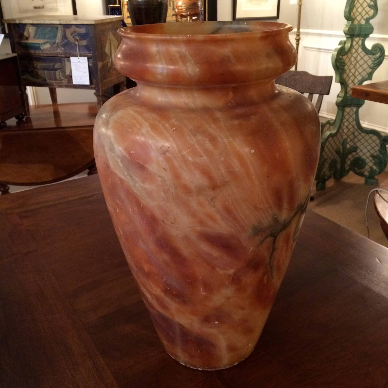 Large-scale mottled alabaster urn vase expertly carved from a single piece of stone.
