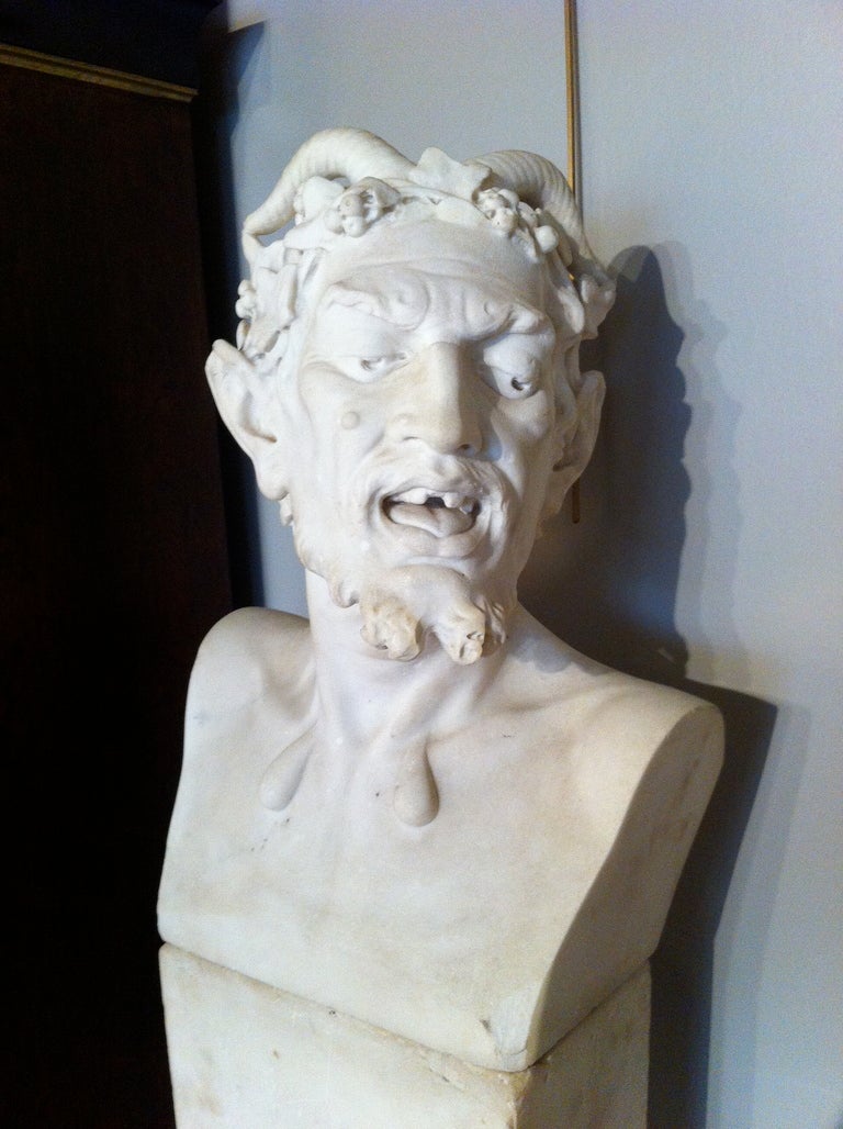 Fine carving in Carrera Marble in the neoclassical style of a Bacchanalian garden herm.
19th century Italian carved white marble bust of a satyr sitting on a two part plinth.

A herm is a stone sculpture serving in antiquity as a boundary marker.