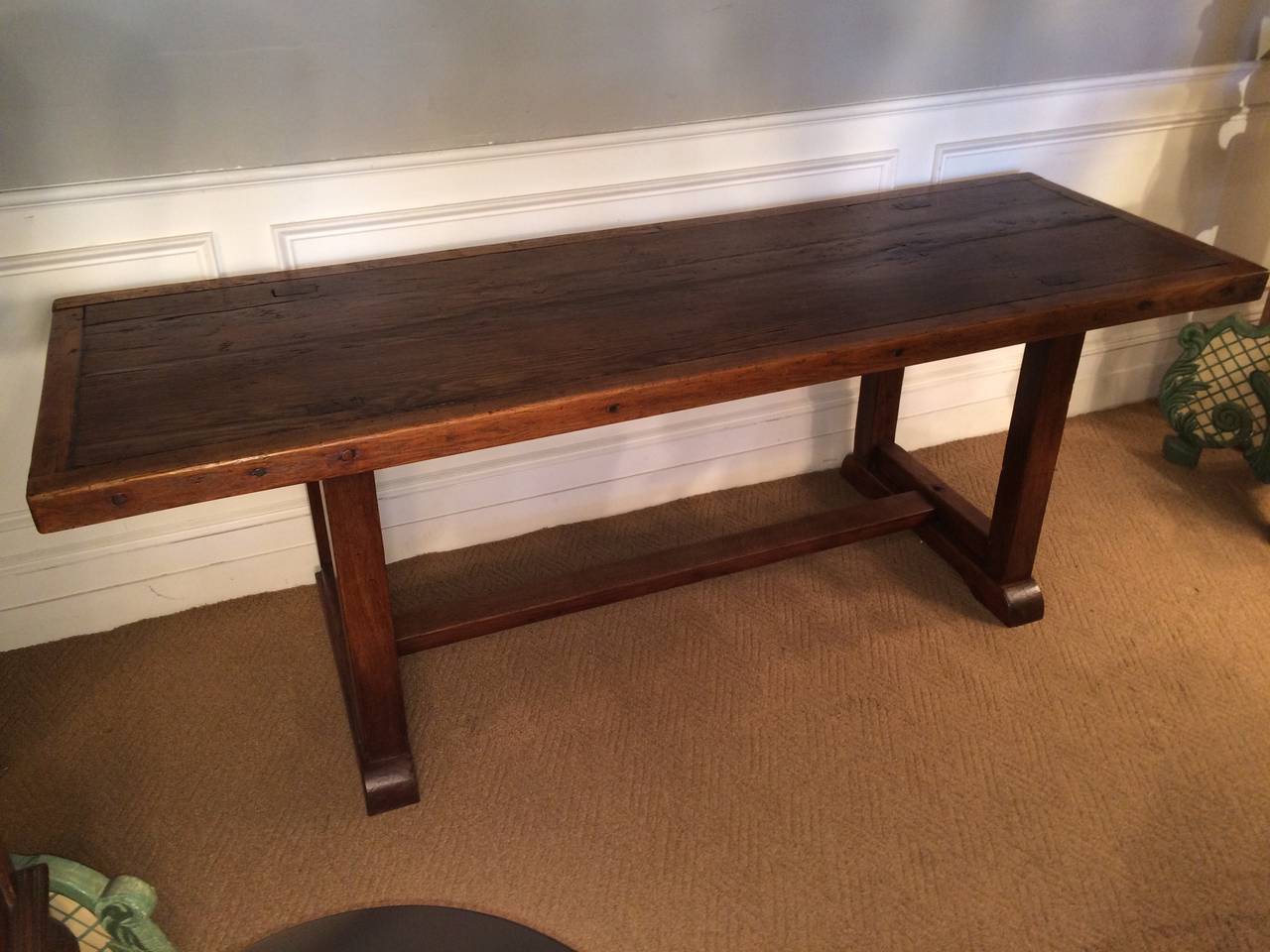 American Arts and Crafts period rustic refectory or farm table beautifully made with mortise and tenon and pegged construction. A handsome and solid table with a warm patina.