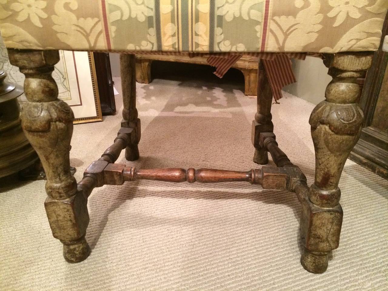 A very handsome pair of 17th century William and Mary side or hall chairs with exquisite carving throughout. Oak with a faded grey that gives these chairs a warm patina.