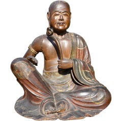 JAPANESE LACQUERED WOOD FIGURE OF A SEATED MONK
