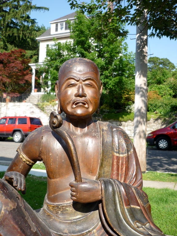 JAPANESE LACQUERED WOOD FIGURE OF A SEATED MONK